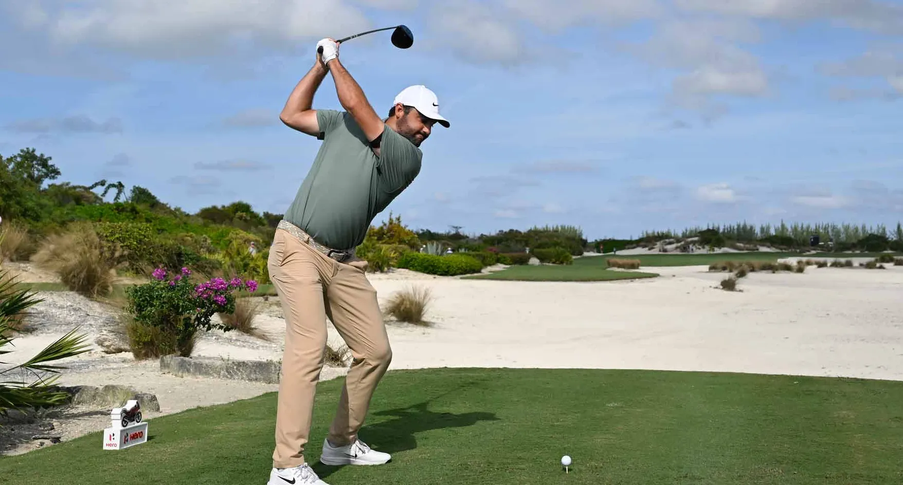 Scottie Scheffler hits drive during the 2025 Hero World Challenge.