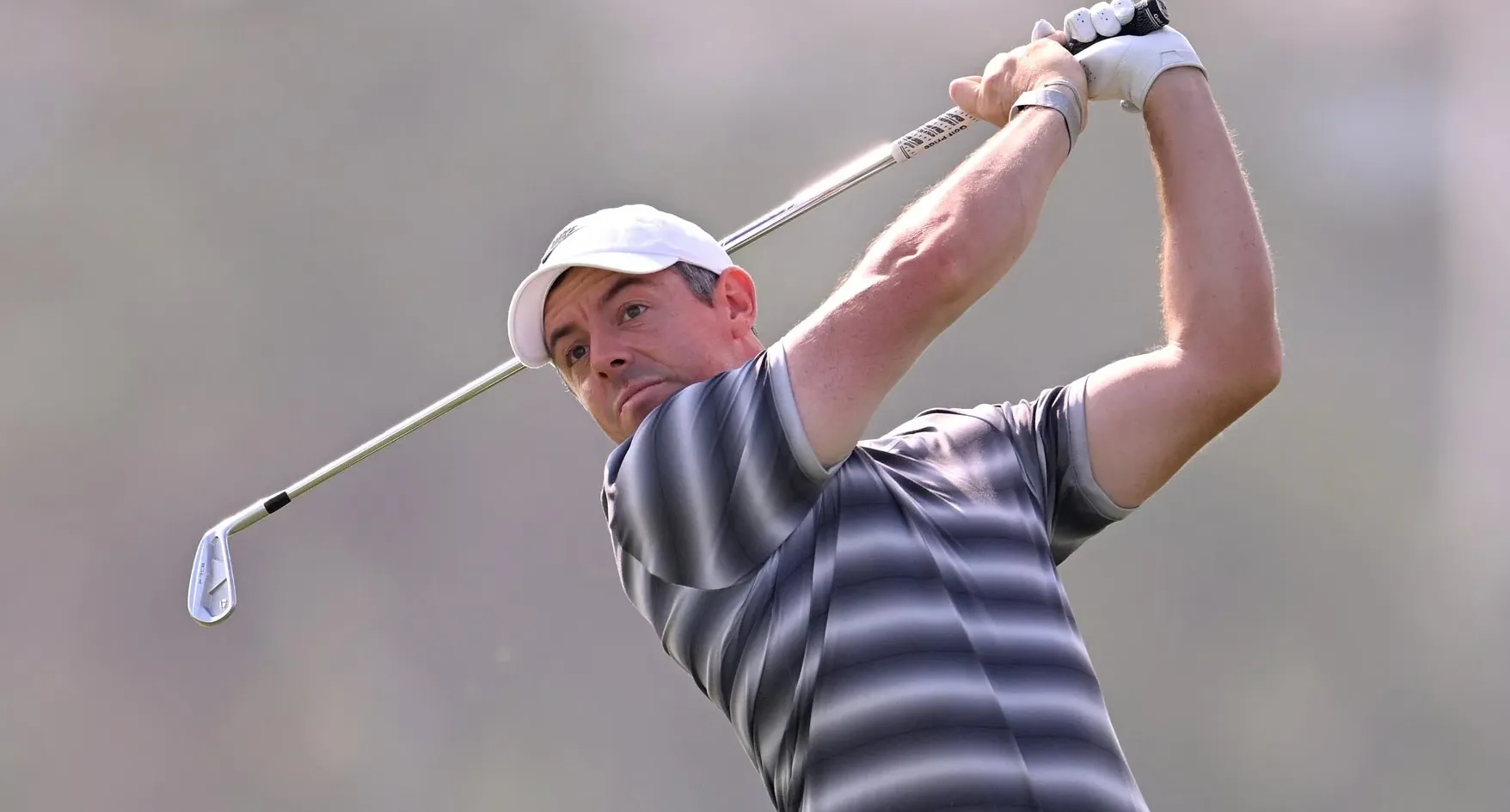 Rory McIlroy of Northern Ireland plays his second shot on the 13th hole on day one of the Dubai Invitational 2026 at Dubai Creek Resort on January 15, 2026 in Dubai, United Arab Emirates. (Photo by Ross Kinnaird/Getty Images)
