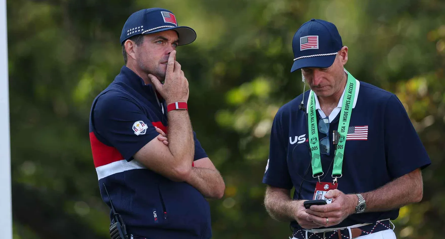 Captain Keegan Bradley of Team United States and vice captain Jim Furyk look on from the eighth hole during the 2025 Ryder Cup at Black Course at Bethpage State Park Golf Course on September 27, 2025 in Farmingdale, New York.