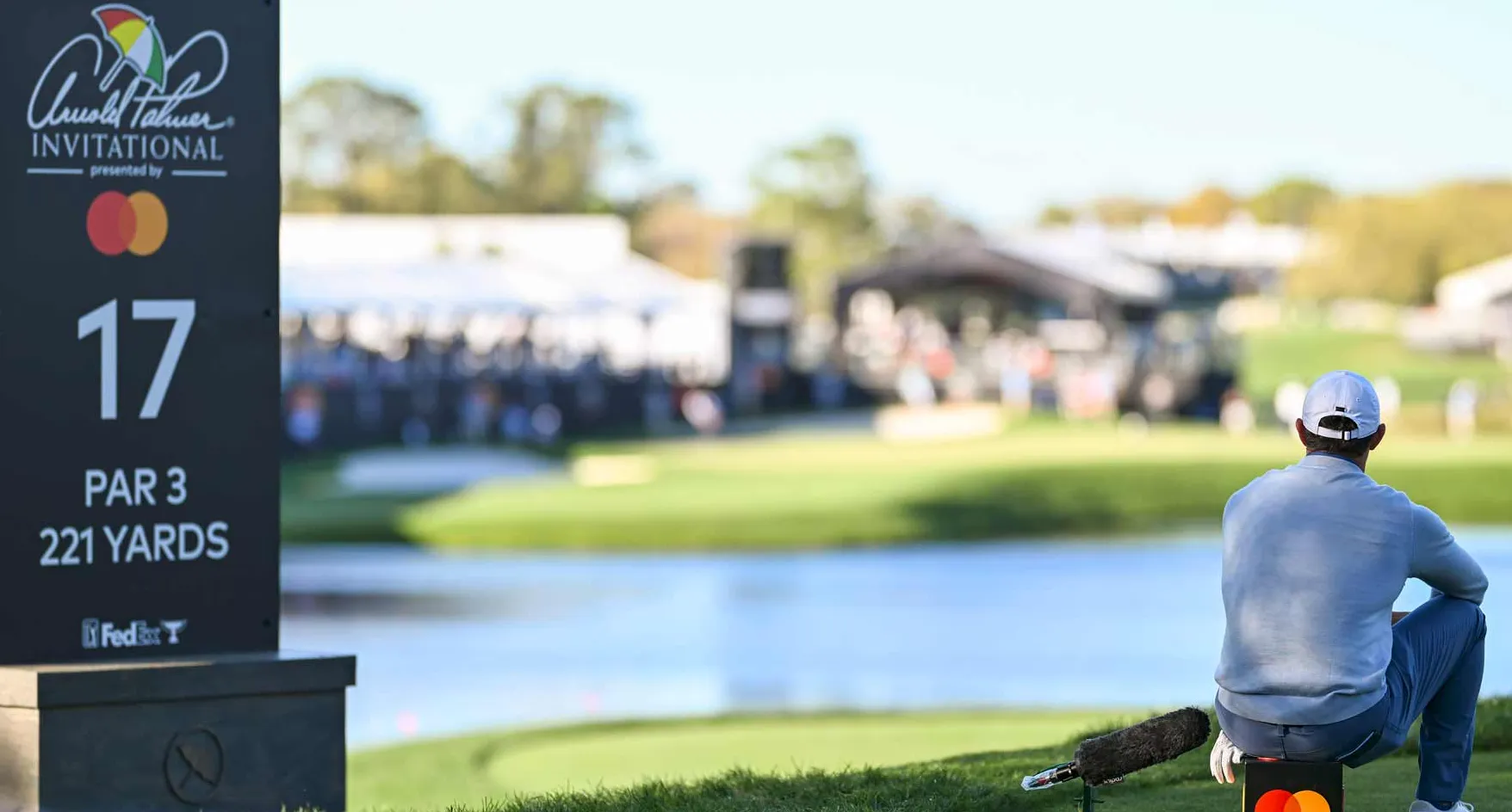Rory McIlroy sits on a tee marker at the Arnold Palmer Invitational in 2025.