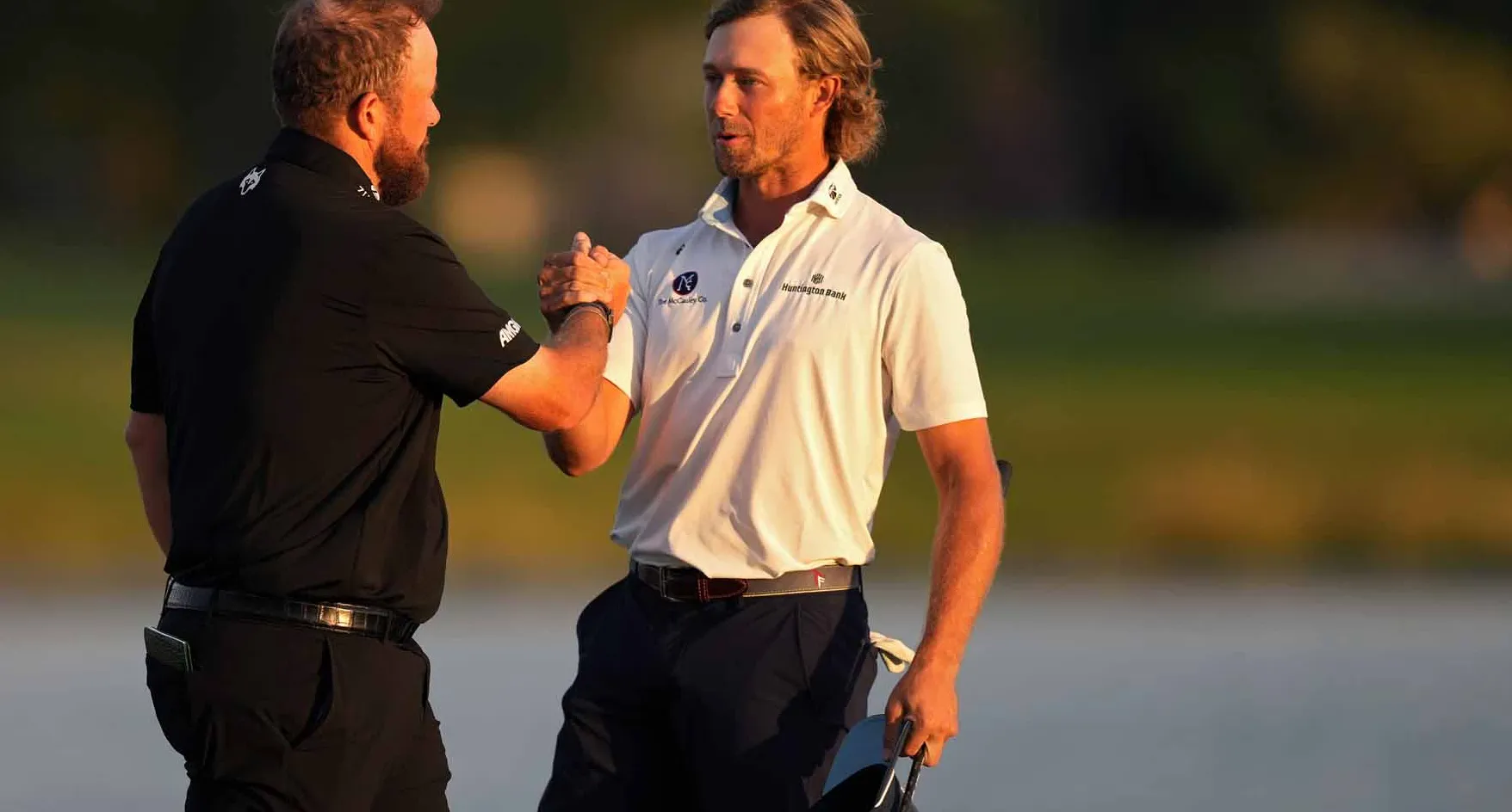 Austin Smotherman and Shane Lowry shake hands