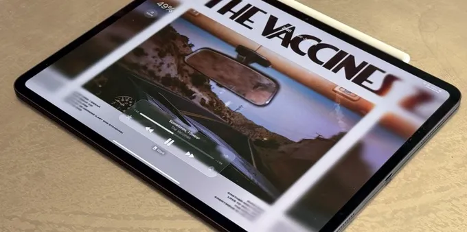 The iPad Pro on a table. It has the Apple Pencil Pro attached to it.