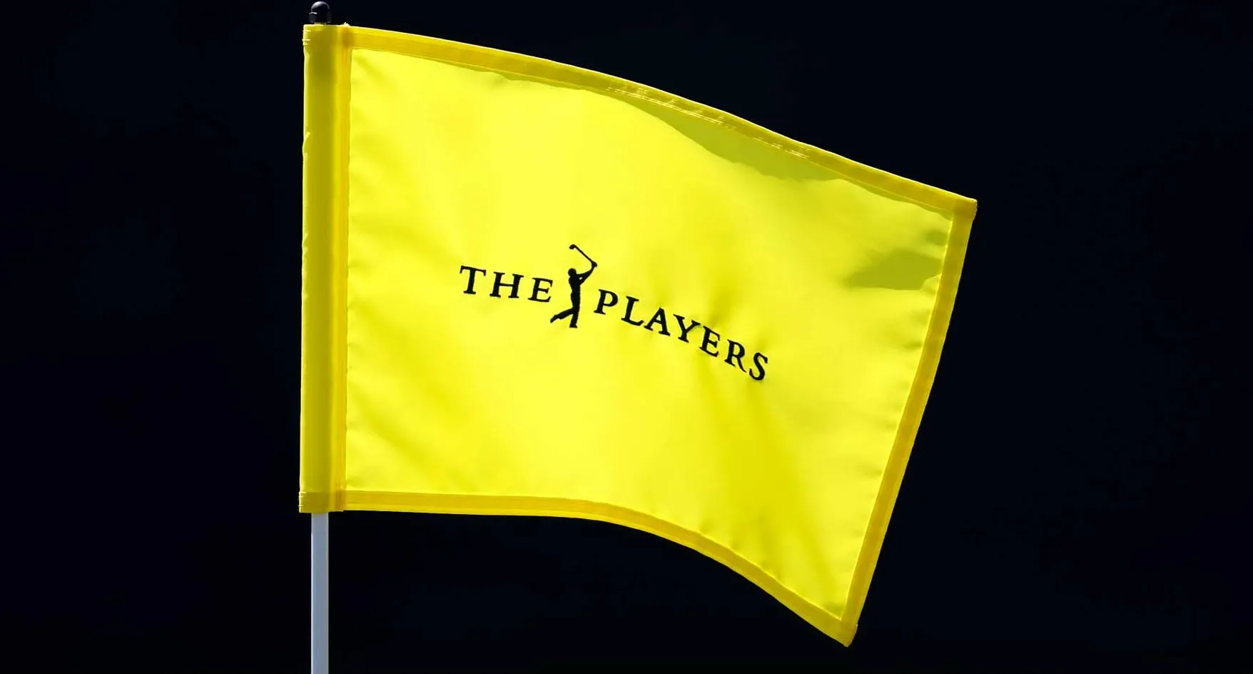 2026 Players Championship flag blows in the wind at TPC Sawgrass' Stadium Course.